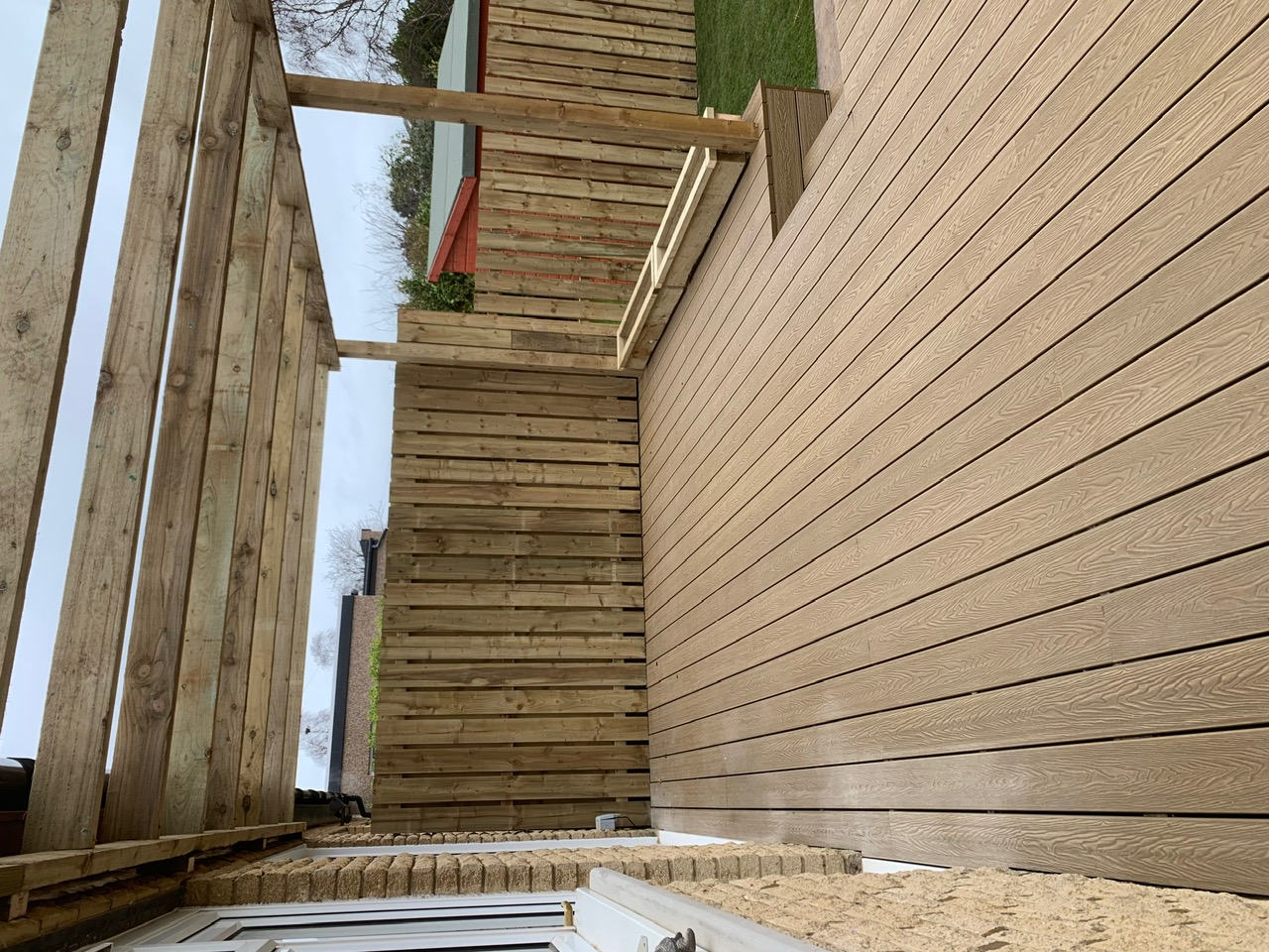 Composite decking with pergola, wooden fence and raised planter - Edinburgh garden design