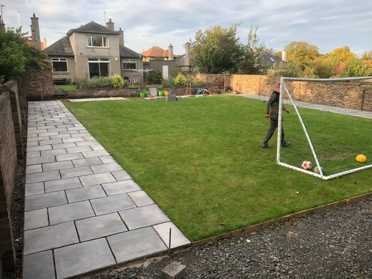Large family garden with grey porcelain patio and new turf lawn - Edinburgh landscaping